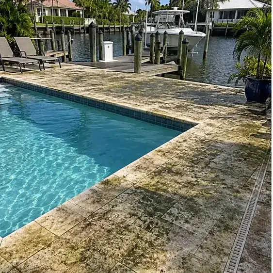 Before cleaning: before and after photos of a Holmes Beach pool deck and canal dock