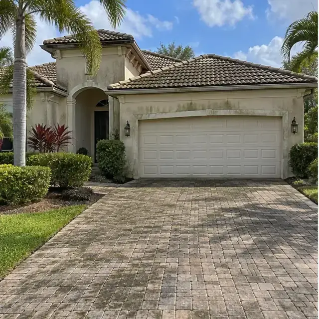 Before cleaning: before and after photos of a Lakewood Ranch tile roof and paver drive