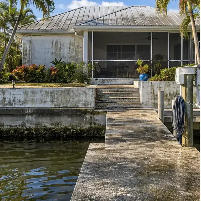 Before cleaning: before and after photos of a Palmetto block home and riverfront dock